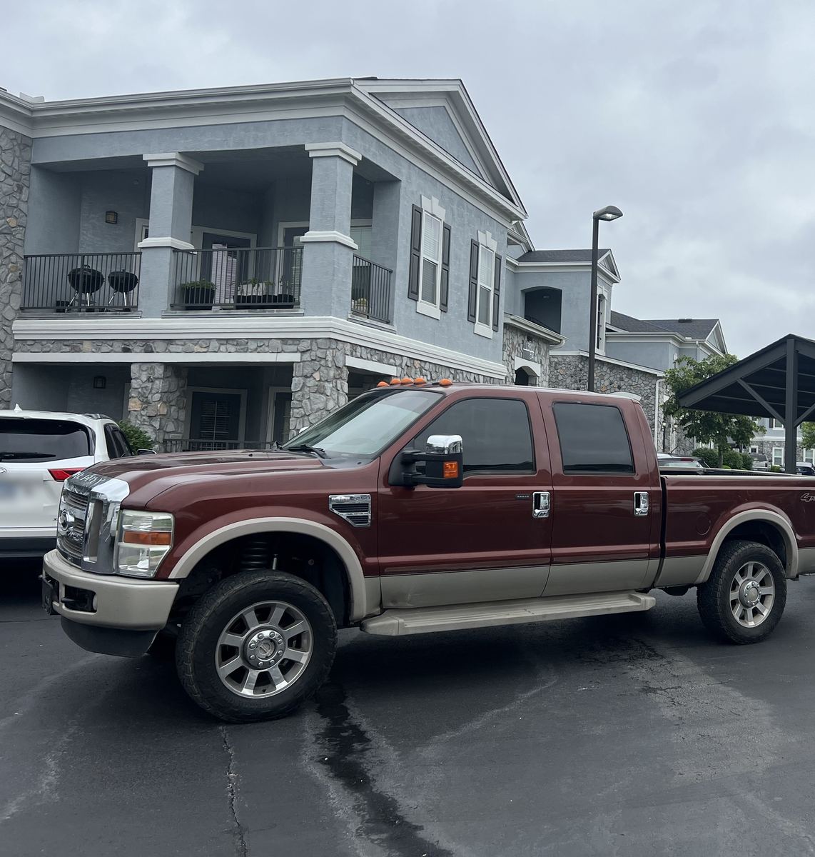 Crew pickup truck parked outside an apartment building on moving day